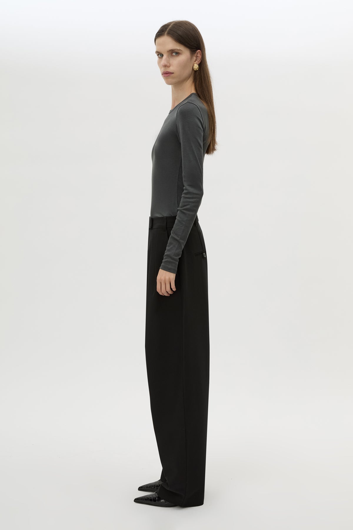 Side view CAMILLA AND MARC Tala Double Pleat Barrel Leg Pant in Black with pressed tapered legs.