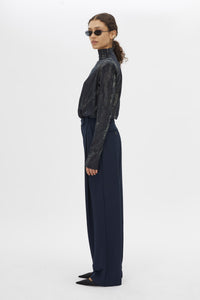 Side view CAMILLA AND MARC Talice Bodysuit in Printed Black with a high fitted neckline.