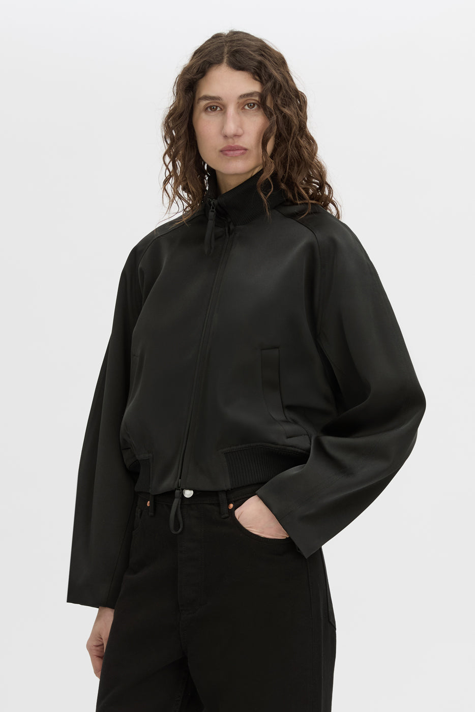 crop view CAMILLA AND MARC Tamar Satin Bomber Jacket in black with double‑ended zipper.