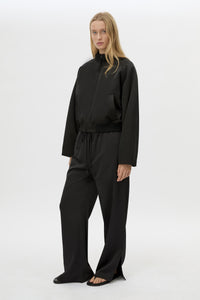 Front view CAMILLA AND MARC Tamar Satin Bomber Jacket in Black styled with the Ground Satin Pant.
