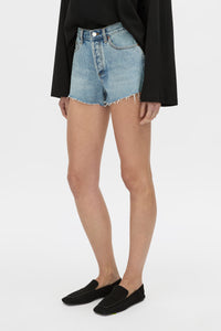 Cropped view CAMILLA AND MARC Tanner Denim Mini Short in light blue with raw‑hem.