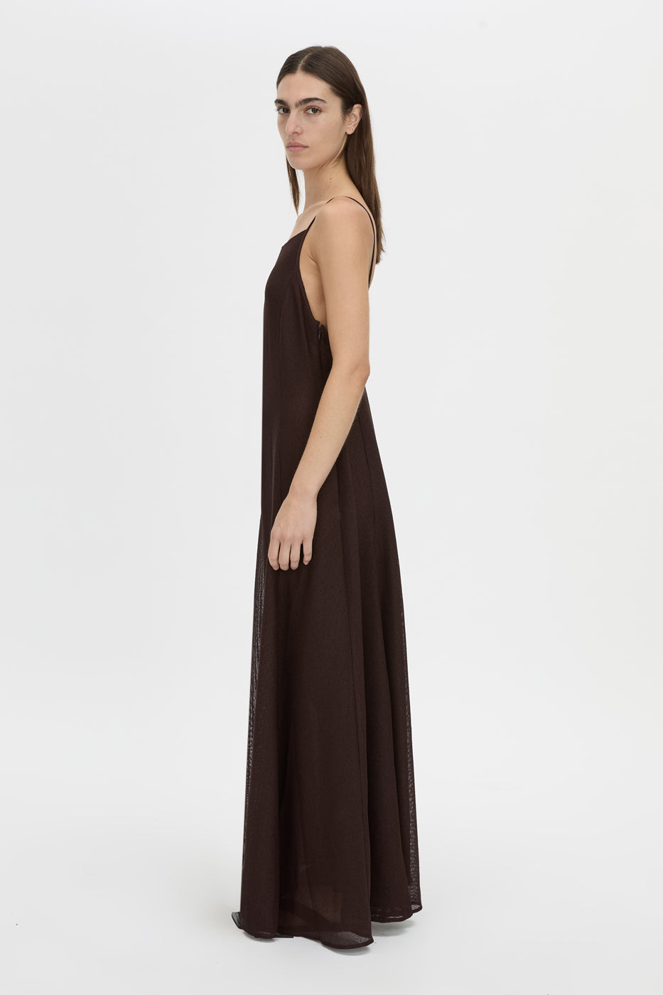 Side view CAMILLA AND MARC Tessara Maxi Dress in chocolate brown with a low‑back.