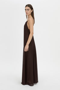 Side view CAMILLA AND MARC Tessara Maxi Dress in chocolate brown with a low‑back.