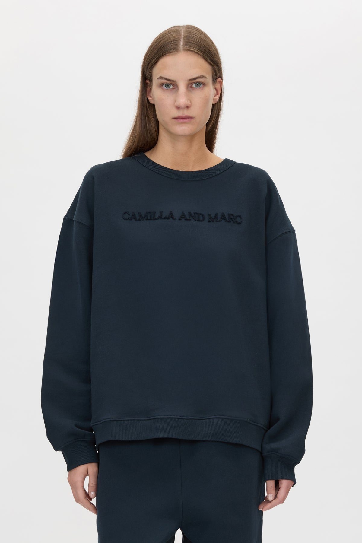 Cropped view CAMILLA AND MARC Tia Flocking Logo Crew in Deep Ink with relaxed fit, logo artwork and 100% cotton.