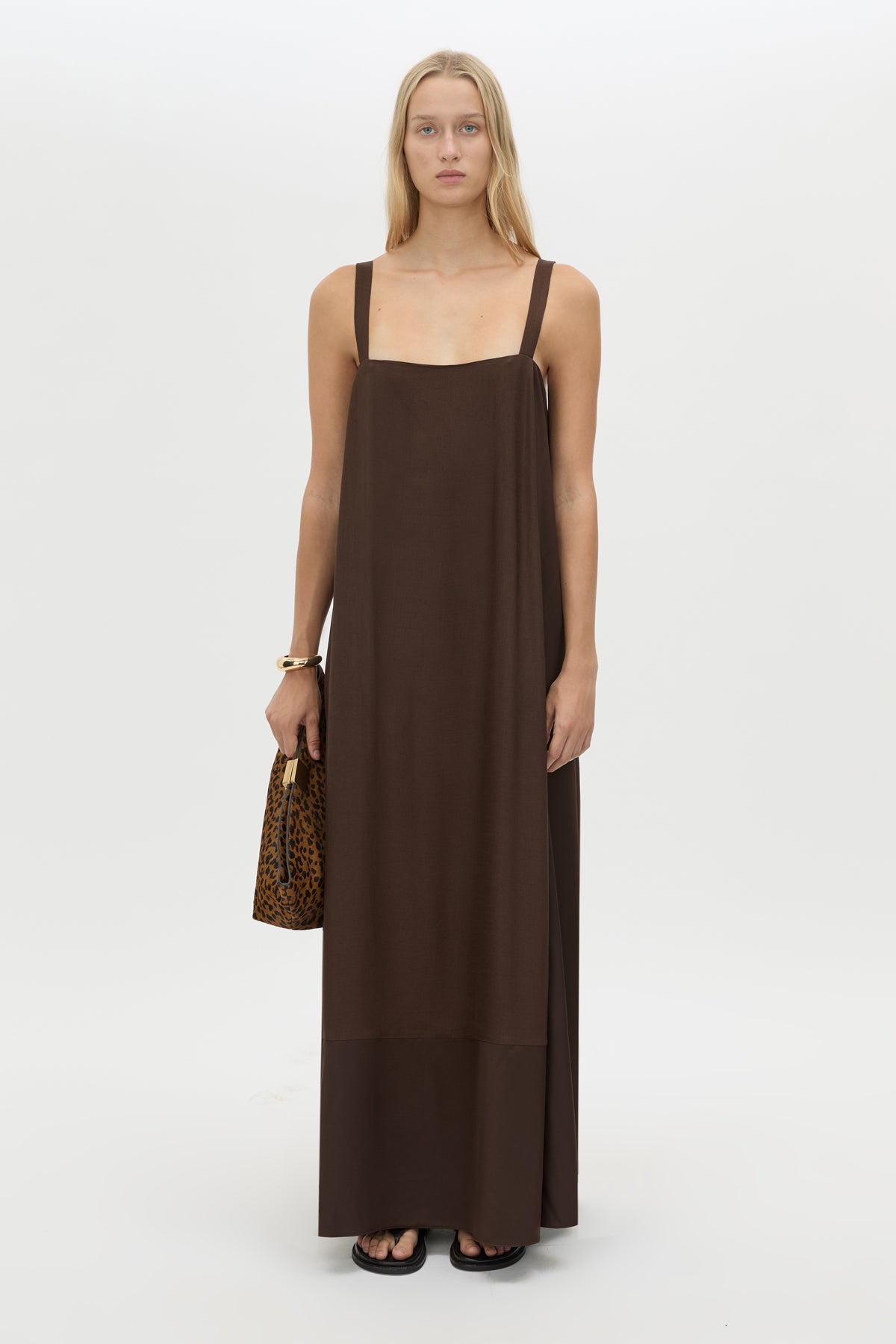 Front styled view CAMILLA AND MARC Tove Maxi Dress in Chocolate with a sleeveless silhouette and contrasting satin trim. 