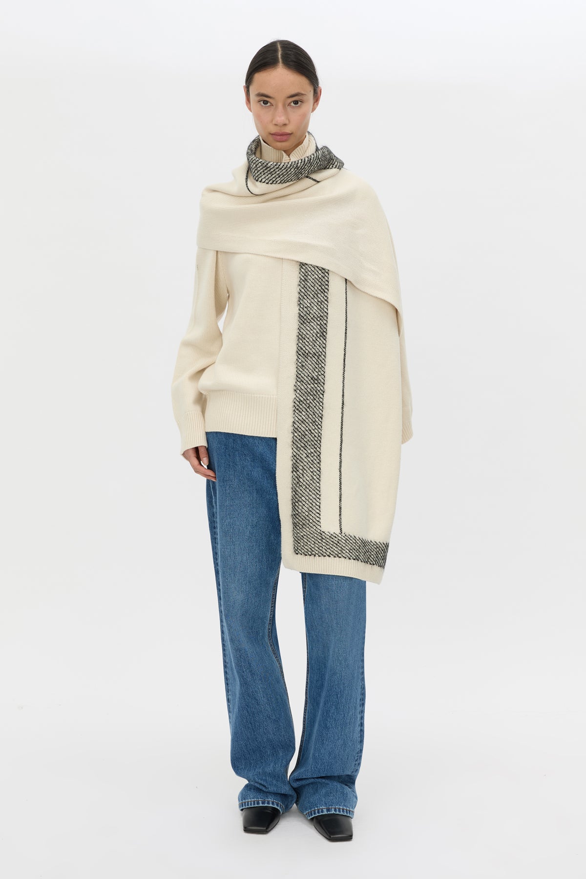 Front view CAMILLA AND MARC Tusk Knit Stripe Scarf in Black with striped jacquard graphic and Australian wool fabrication.