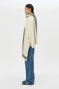 Side view CAMILLA AND MARC Tusk Knit Stripe Scarf in Black with striped jacquard graphic and Australian wool fabrication.