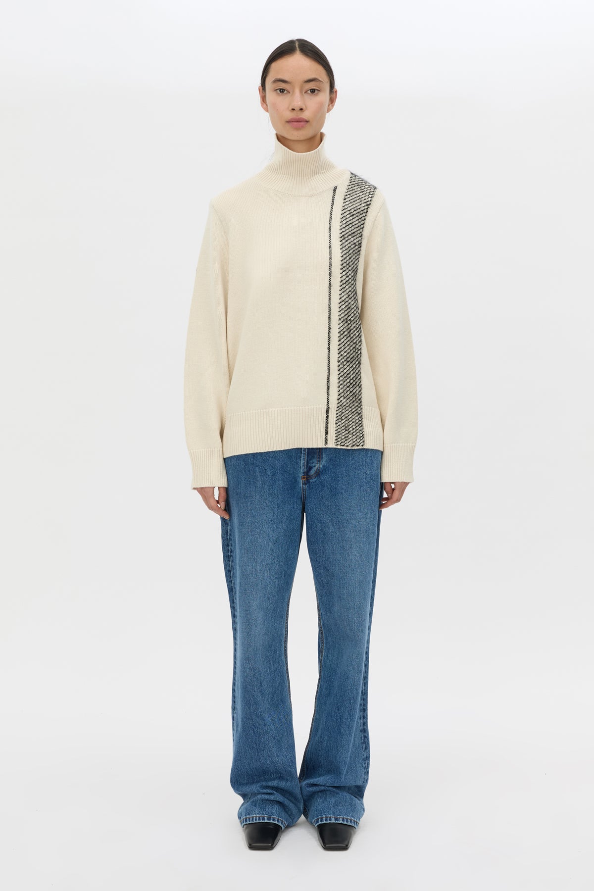 Front styled view CAMILLA AND MARC Tusk Detail Knit Turtleneck in Black with contrast jacquard stripe and Australian wool.