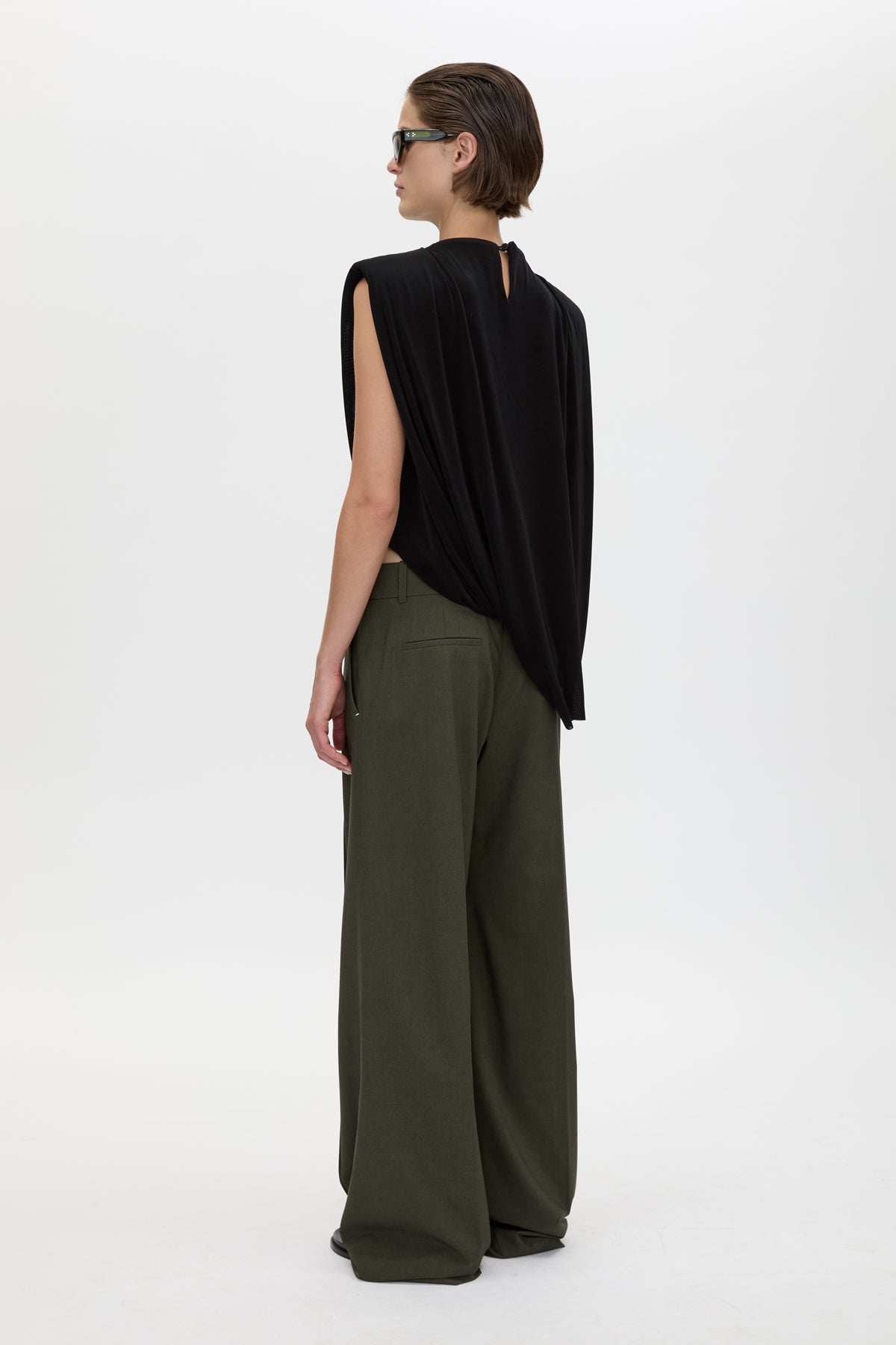 Back view CAMILLA AND MARC Una Straight Leg Trouser in Emerald Green with front pintucks, and a tailored waistband.