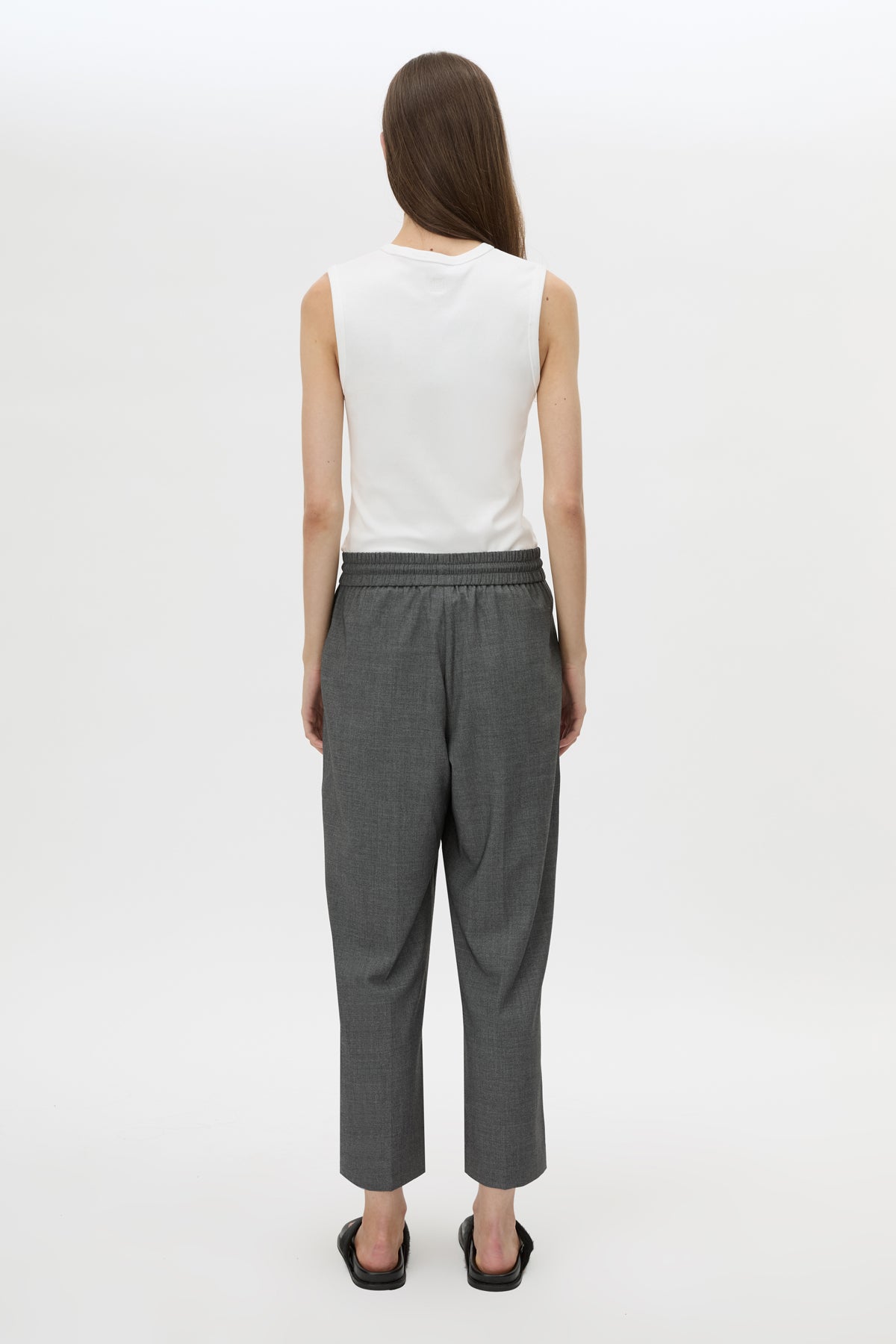 Back view CAMILLA AND MARC Vector Crop Pant in Charcoal Grey with soft suiting fabrication.
