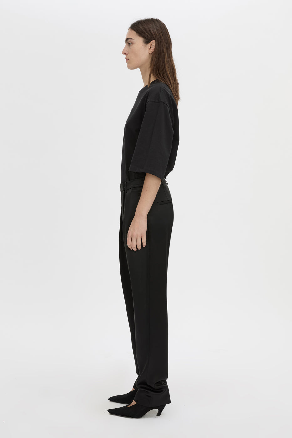 Side view CAMILLA AND MARC Velin Pant in black with pleated bow‑leg design.