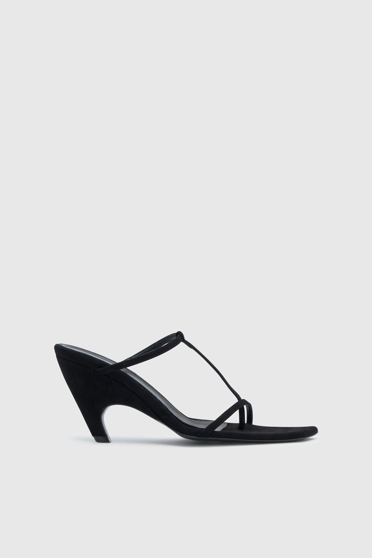 Ghost side view CAMILLA AND MARC Wave Mule in black soft goat suede with heeled sandal design.