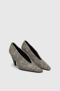 Three-quarter view CAMILLA AND MARC Wave Spotted Pump in Black and White with textured finish and angled heel.