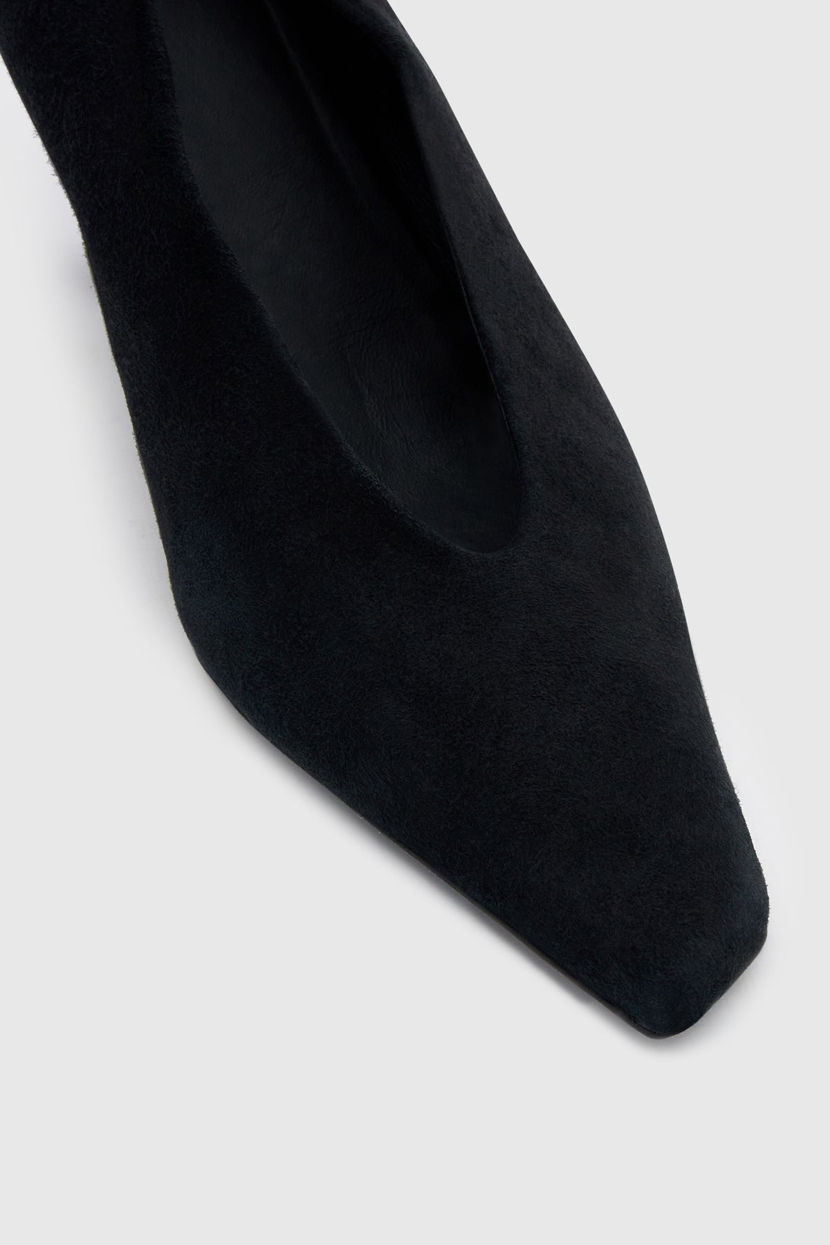 Cropped view CAMILLA AND MARC Wave Pump in Black suede with narrow square toe and angled heel.