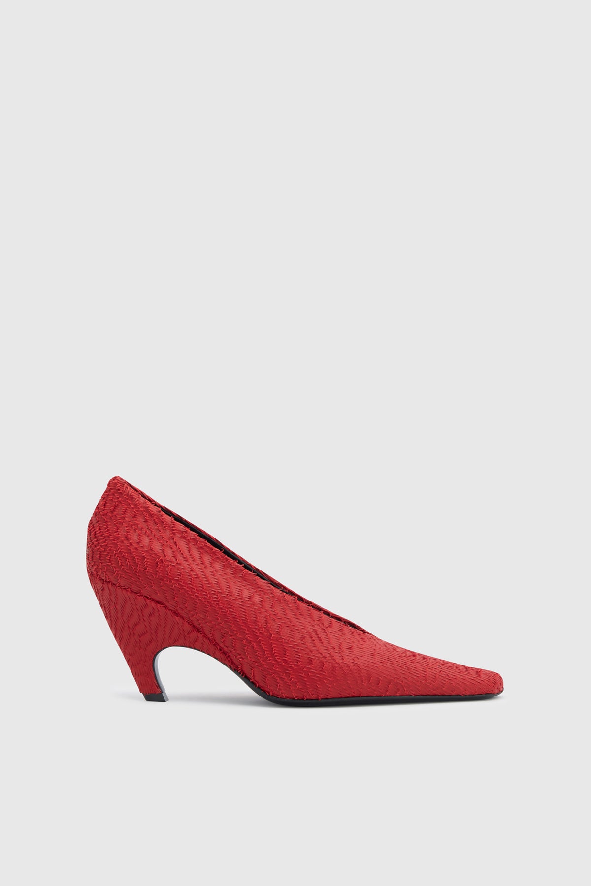 Side ghost view CAMILLA AND MARC Wave Textured Pump in red laser‑cut goat leather.