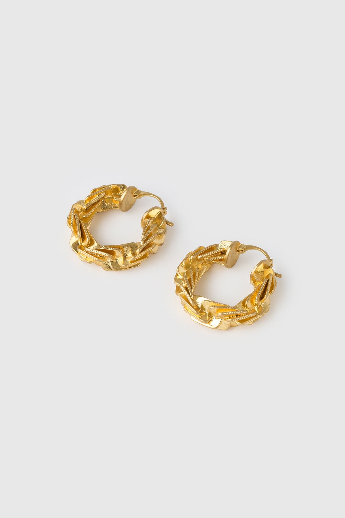 Three-quarter view CAMILLA AND MARC Wrenley Hoops with worn‑look 18k gold plating.