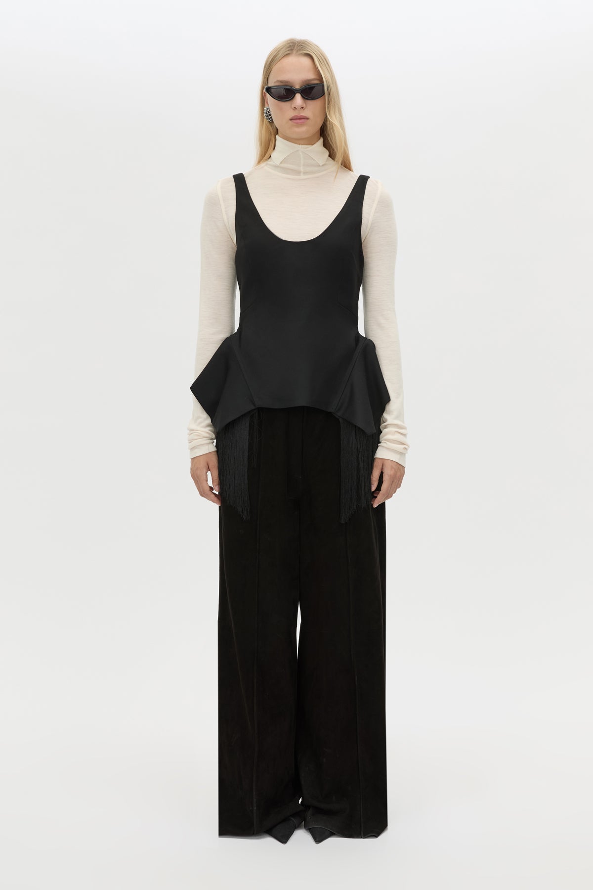 Front styled view CAMILLA AND MARC Zaman Top in Black with a structured sleeveless design and detachable hem fringe.