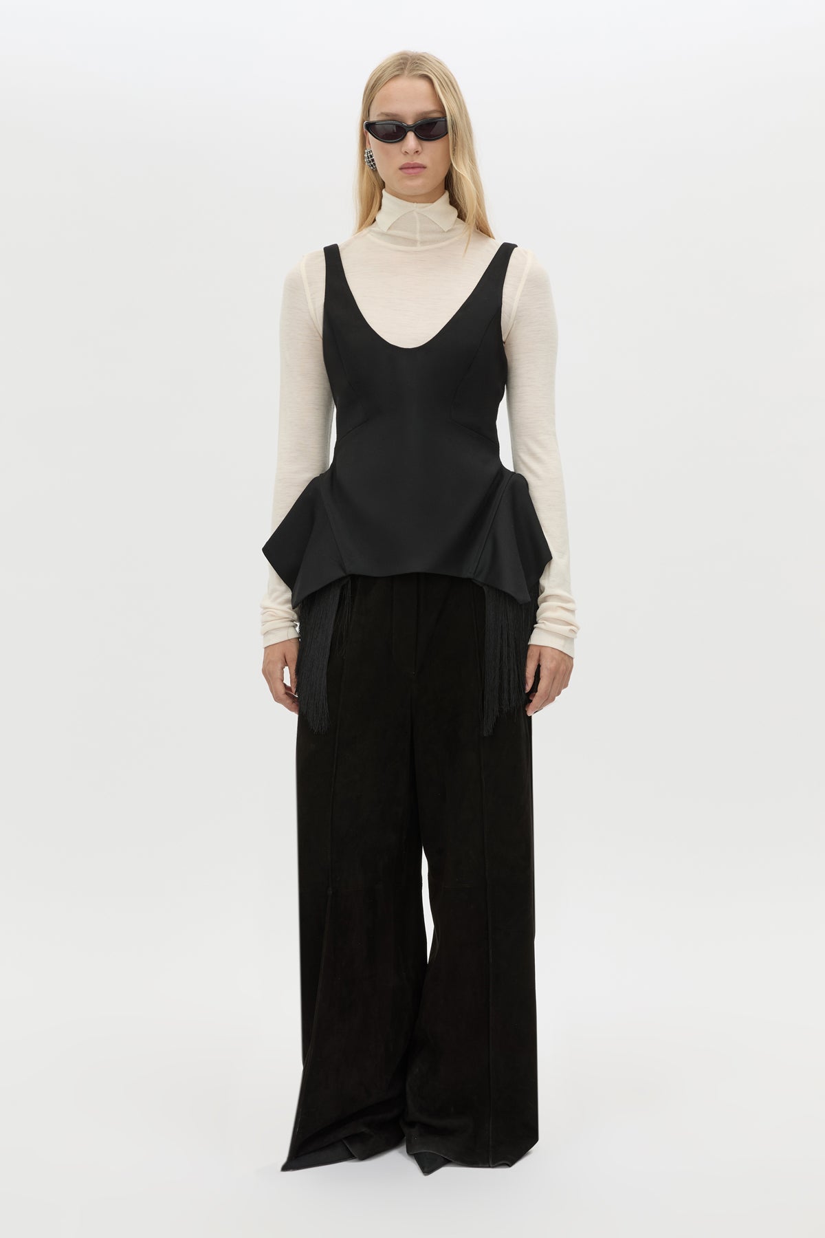 Front view CAMILLA AND MARC Zaman Top in Black with a structured sleeveless design and detachable hem fringe.