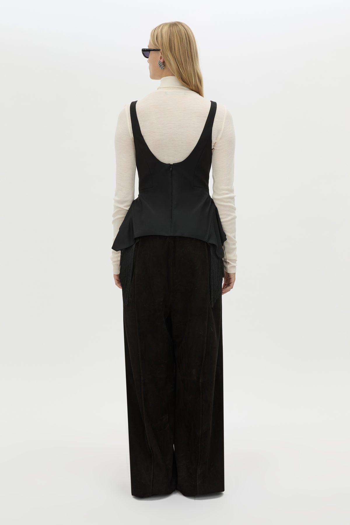 Back view CAMILLA AND MARC Zaman Top in Black with a structured sleeveless design and detachable hem fringe.
