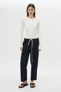 Styled view CAMILLA AND MARC Zylus straight-leg tracksuit pant in navy with embroidered monogram.