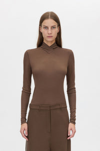 Cropped view CAMILLA AND MARC Axial Top in Chocolate with layered cross‑over high neck.