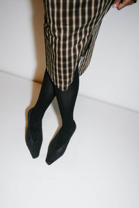 Campaign view CAMILLA AND MARC Wave Textured Pump in black laser‑cut goat leather.