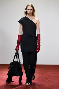 Campaign view CAMILLA AND MARC one-shoulder Namira Mini Dress in black with asymmetric laser‑cut draped panel.