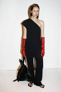 Campaign styled view CAMILLA AND MARC one-shoulder Namira Mini Dress in black with asymmetric laser‑cut draped panel.