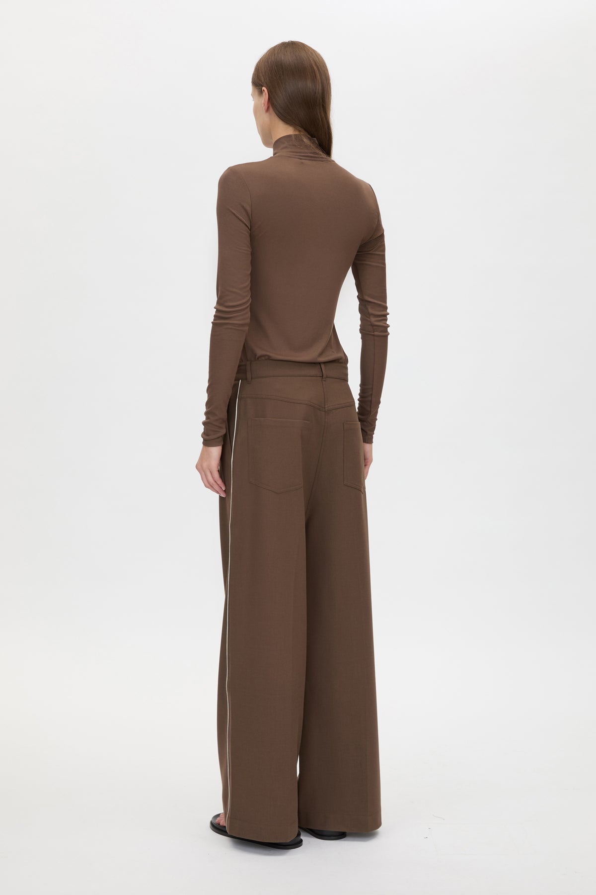 Back view CAMILLA AND MARC Axial Top in Chocolate with layered cross‑over high neck.
