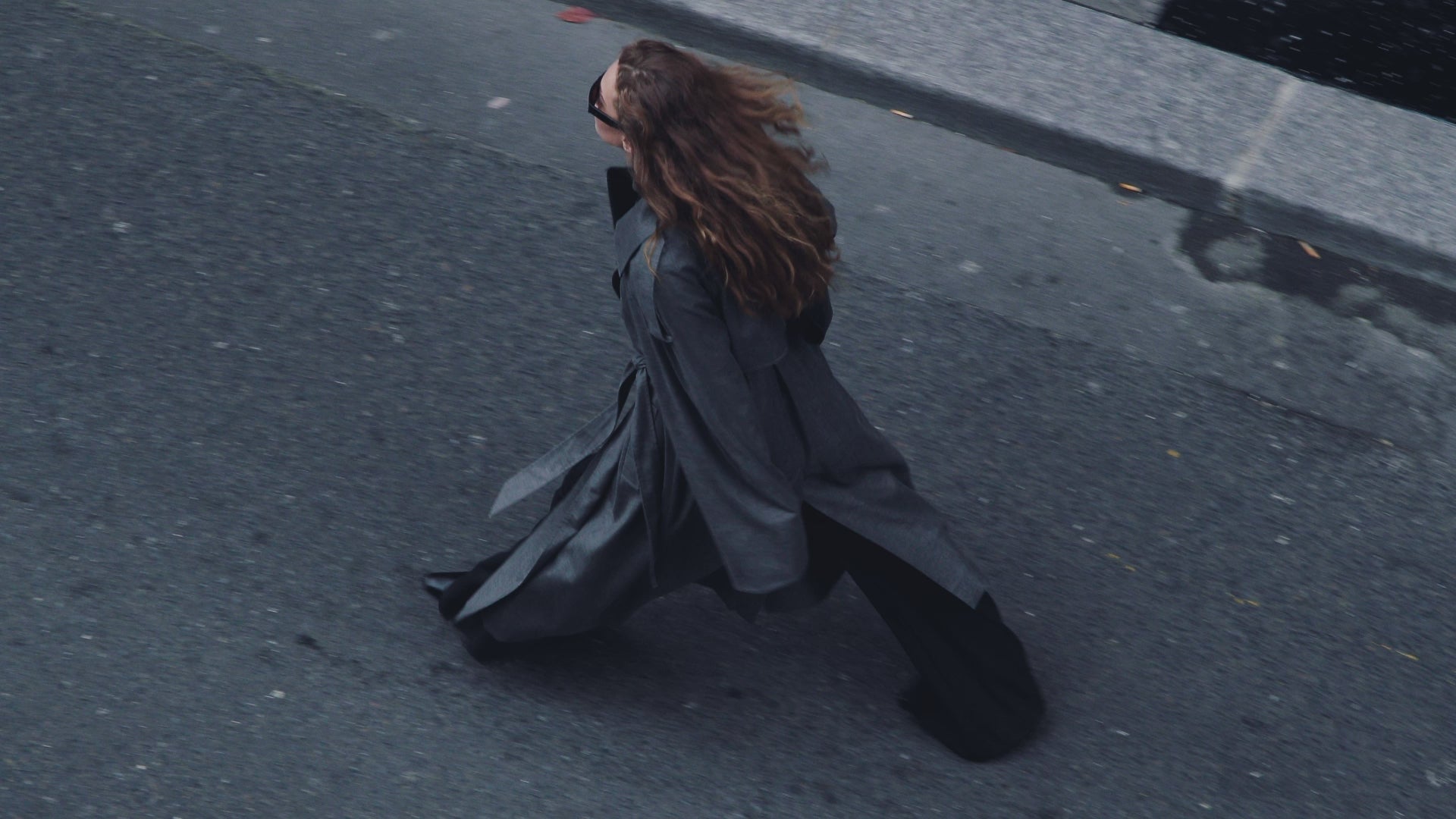 CAMILLA AND MARC AW26 collection -Model wearing Ember Trench Coat in grey with waist belt.