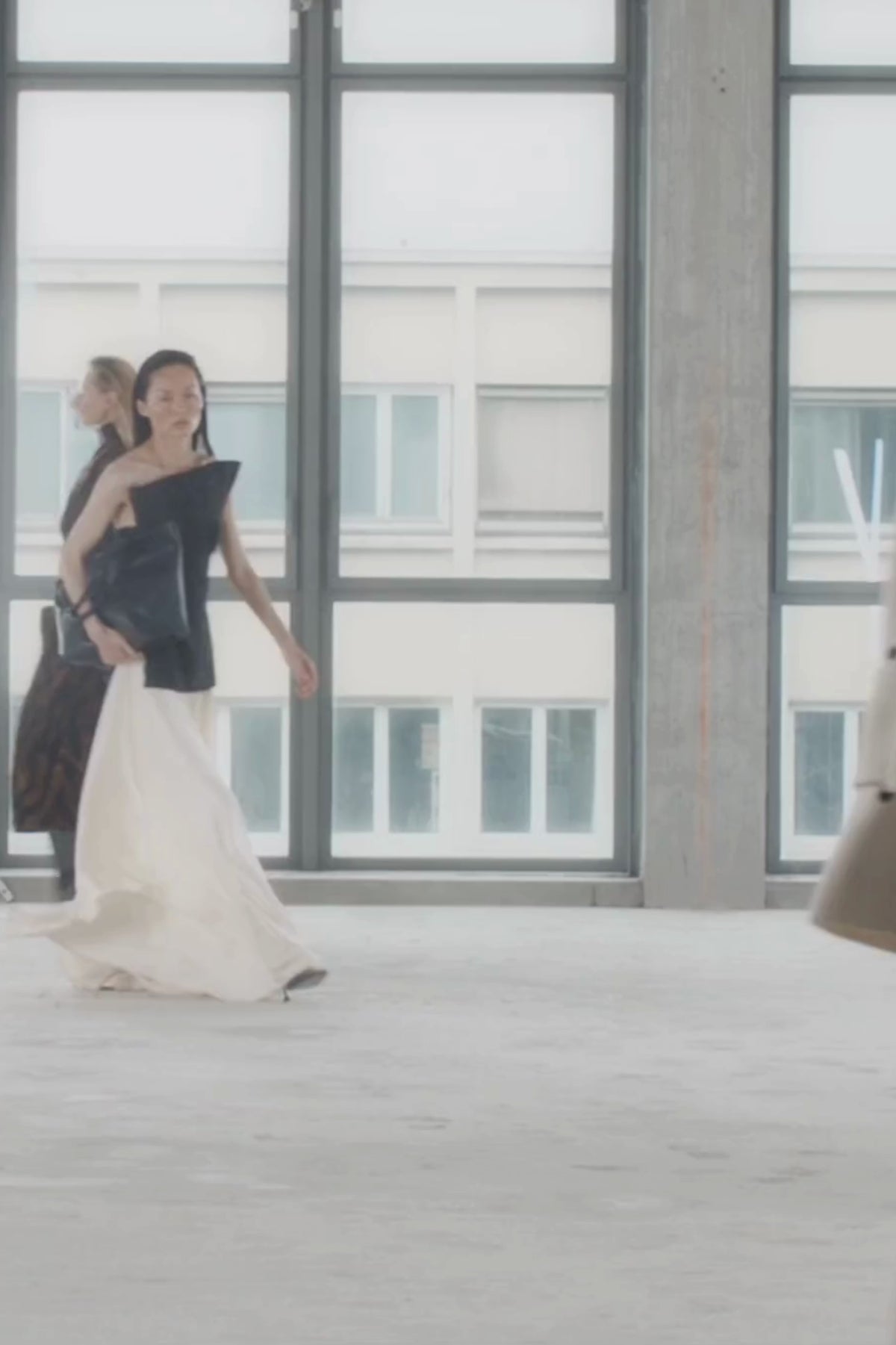 Runway video CAMILLA AND MARC Elise Top in Black with sculpted fit, off‑shoulder design and side hem splits.