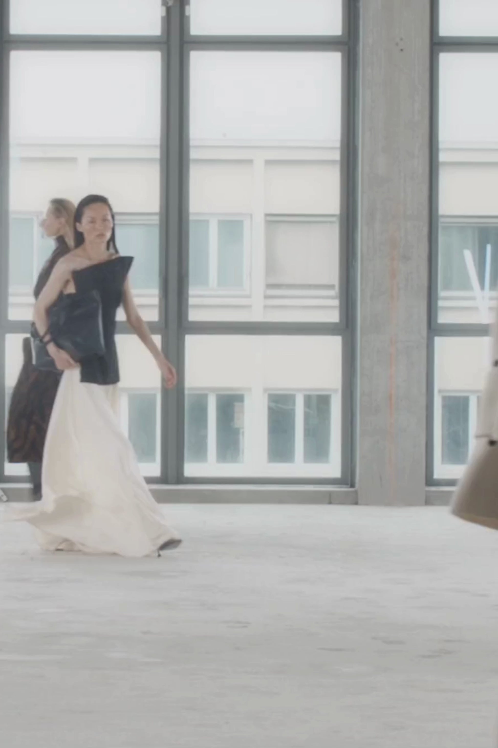 Runway video CAMILLA AND MARC Elise Top in Black with sculpted fit, off‑shoulder design and side hem splits.