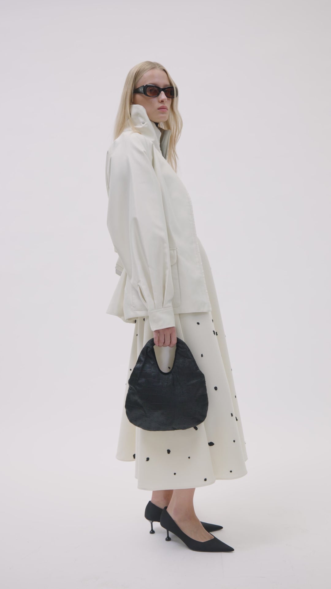 Styled video CAMILLA AND MARC Remi Mini Bag in Black leather with embossed pony croc texture.