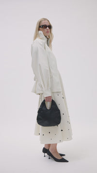 Styled video CAMILLA AND MARC Remi Mini Bag in Black leather with embossed pony croc texture.