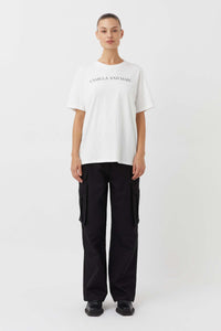 CAMILLA AND MARC Asher Cotton Logo Tee in White.

The Asher Tee seamlessly blends comfort and style, making it a perfect choice for any casual occasion. This tee is crafted from premium quality cotton and promises a soft and breathable feel, ensuring all-day comfort. The relaxed fit and logo elevate this tee making it an instant wardrobe hero.